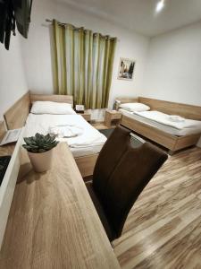 Postel nebo postele na pokoji v ubytování Agát