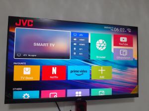 a television screen with different colored icons on it at Sunlit Retreat Constantia Kloof in Roodepoort