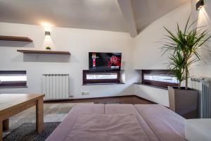 Postel nebo postele na pokoji v ubytování Vijećnica Loft Apartment