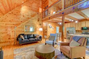 a living room with a couch and a table at Rhododendron Rendezvous in Blowing Rock