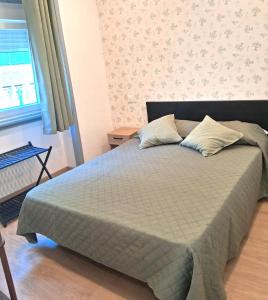 Ένα ή περισσότερα κρεβάτια σε δωμάτιο στο Guest House Morais