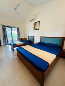 Postel nebo postele na pokoji v ubytování Golden Maple Villa