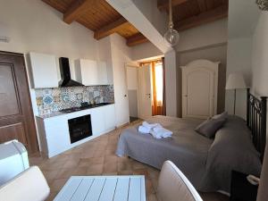 a bedroom with a bed and a fireplace at Avola Opera House in Avola