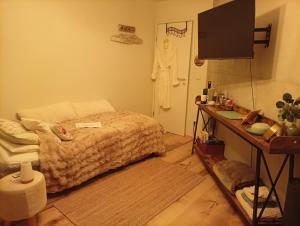 a bedroom with a bed and a dresser and a television at Einzelzimmer neu, von Privatperson , inkl Netflix in Bielefeld +17 photos