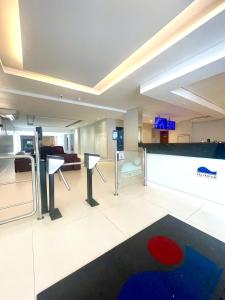 a large room with a pool table in a building at Skyblue Flat in São Vicente +13 photos