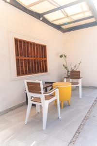 a room with a table and chairs and a window at Villas Manglar Sisal 5 by WoWay Experiences in Sisal