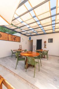a room with tables and chairs and a skylight at Villas Manglar Sisal 5 by WoWay Experiences in Sisal