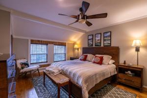 a bedroom with a bed and a ceiling fan at Four Bear Falls in Banner Elk