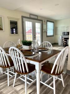 a dining room with a wooden table and chairs at Group HQ, 9BR Near Falls, Casino & Attractions in Niagara Falls