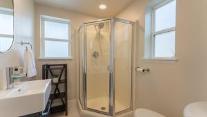 a bathroom with a shower and a sink at Amazing Lakefront Paradise with Perfect Location in Osage Beach +35 photos