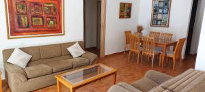 a living room with a couch and a table at 4-Bedroom chalet for Ski and Summer in Kfardebian