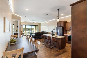 a kitchen and living room with a table and chairs at Brand New Complex, Central Location, Amazing Views in Laguna Beach