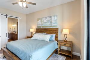 a bedroom with a blue bed and two lamps at Brand New Complex, Central Location, Amazing Views in Laguna Beach +70 photos