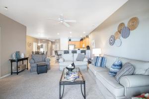 a living room with a couch and a table at Experience Lakeside Living at Its Finest: Stunning Views and Prime Location! in Laguna Beach