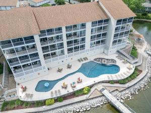 an overhead view of a building with a swimming pool at Experience Lakeside Living at Its Finest: Stunning Views and Prime Location! in Laguna Beach