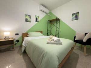 Postel nebo postele na pokoji v ubytování Agriturismo Cydonia Home