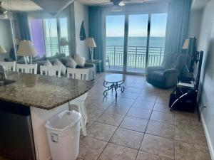 a living room with a view of the ocean at Ocean Walk Resort - Fabulous Ocean Front View in Daytona Beach