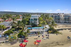 an aerial view of a beach with a resort at Stay at Ultravioleta Cabarete Beachfront Apartments by EvoKey in Cabarete