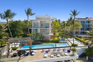an aerial view of a villa with a swimming pool at Stay at Ultravioleta Cabarete Beachfront Apartments by EvoKey in Cabarete