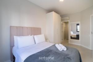 Ένα ή περισσότερα κρεβάτια σε δωμάτιο στο Apto 2 Quartos a 300 m da Beira-mar Norte EVP0214