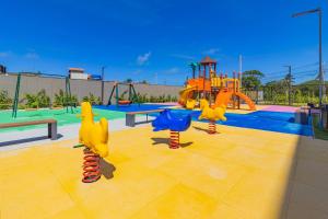 a childrens playground with a slide at Beach Class Summer resort condominium by Carpediem in Porto De Galinhas