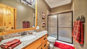 a bathroom with a sink and a toilet and a shower at Hot Tub, Fire Pit, Awesome Loft & Amazing Views! in Buck Creek +36 photos