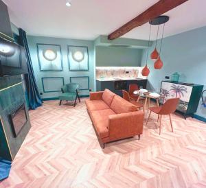 a living room with a couch and a table at Lemon Suites Santander in Santander