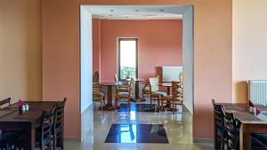 a dining room with a table and chairs at Hotel Wintera Gudauri in Gudauri