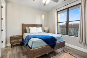 a bedroom with a bed and a large window at Topsider Condo w/ Updated Design & Amazing Main Channel Views in Laguna Beach +56 photos