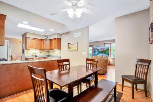 a kitchen and dining room with a table and chairs at Ideal Cove with Amazing Dock, Kayaks & Fire Pit in Sunrise Beach