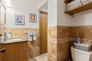 a bathroom with a toilet and a sink at Spacious, Quiet & Great Cove, Nearby Attractions, Private Dock, Fireplace, Expansive Deck in Rocky Mount +67 photos