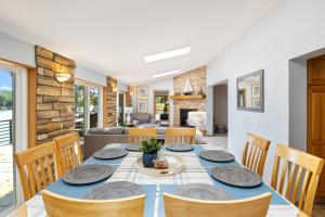 a dining room with a table and chairs at Spacious, Quiet & Great Cove, Nearby Attractions, Private Dock, Fireplace, Expansive Deck in Rocky Mount