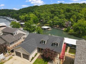 an aerial view of a house with a river at Lux Lakehouse w/ 2 Living Areas, Screened Porch & Dock Access at 22MM in Damsel