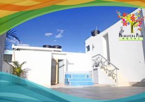 a white building with a sign for a hotel at Hotel Primavera Plaza in Melgar