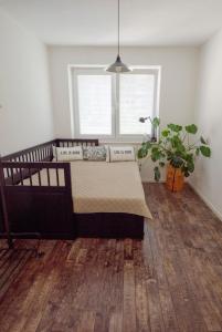 a bedroom with a bed and a window at Spacious Apartment,Balcony&Garage in Bratislava