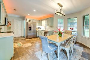 a kitchen and dining room with a table and chairs at Walk to Lake Athens! Updated Home with Large Deck in Murchison