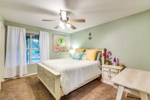 a bedroom with a bed and a ceiling fan at Walk to Lake Athens! Updated Home with Large Deck in Murchison