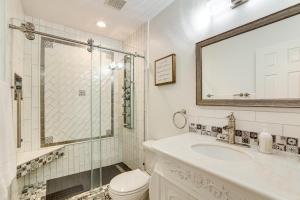 a bathroom with a shower and a toilet and a sink at Walk to Lake Athens! Updated Home with Large Deck in Murchison +17 photos