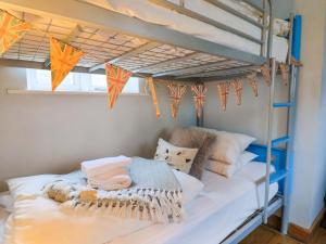 a bedroom with bunk beds with kites on them at Seaside in Lyme Regis