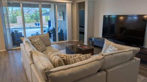 a living room with a couch and a television at Blue Agave Dreams in Marana