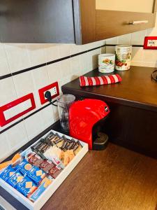 a counter in a restaurant with a box of food at Appartamenti Abbaidda in Valledoria