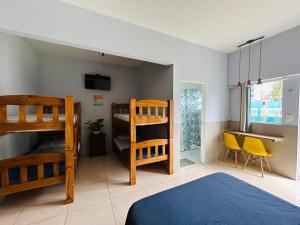 Postel nebo postele na pokoji v ubytování Imperial beach enseada