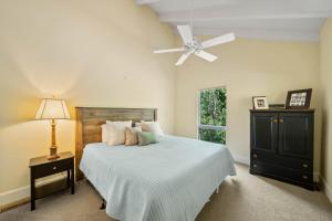 a bedroom with a bed with a ceiling fan at Banner Elk Valley Overlook in Banner Elk