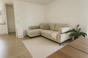 a living room with a couch and a rug at Modern House in Spielberg near Red Bull Ring in Spielberg +1 photo