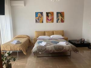 Ένα ή περισσότερα κρεβάτια σε δωμάτιο στο OLIVIA e TETI