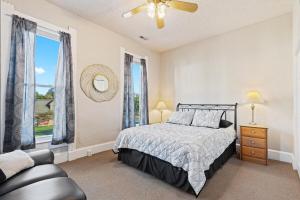 a bedroom with a bed and a large window at Big Yellow in Indianapolis