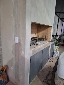 a unfinished wall with a fireplace in a room at Nuevo Departamento Moderno Charata in Charata +3 photos