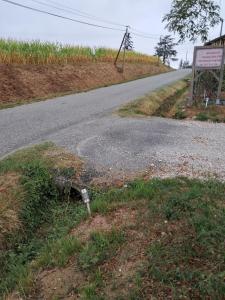 an empty road with a sign on the side of it at Le chalet bien-être de Vanessa in Peyret-Saint-André