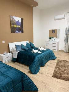 Giường trong phòng chung tại Roan home Pompei