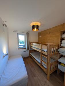 Voodi või voodid majutusasutuse Ambiance chalet à la montagne - Val Louron toas